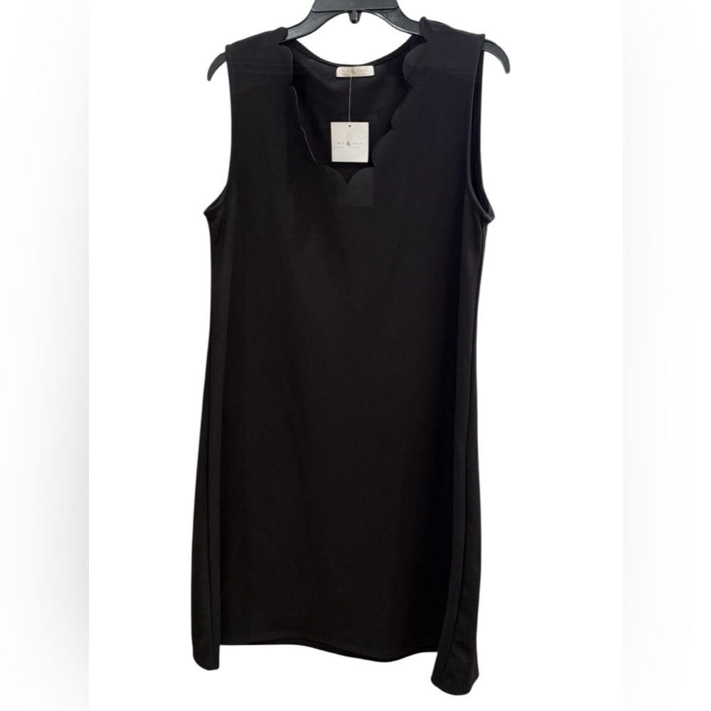 NWT. NIC & LULU, size large, black dress with scalloped V-neck.